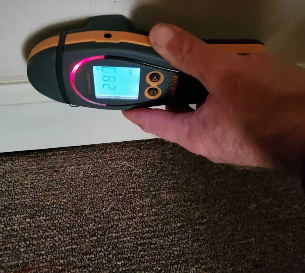 Moisture detection at baseboard during Storm Damage Restoration in Silver Lakes